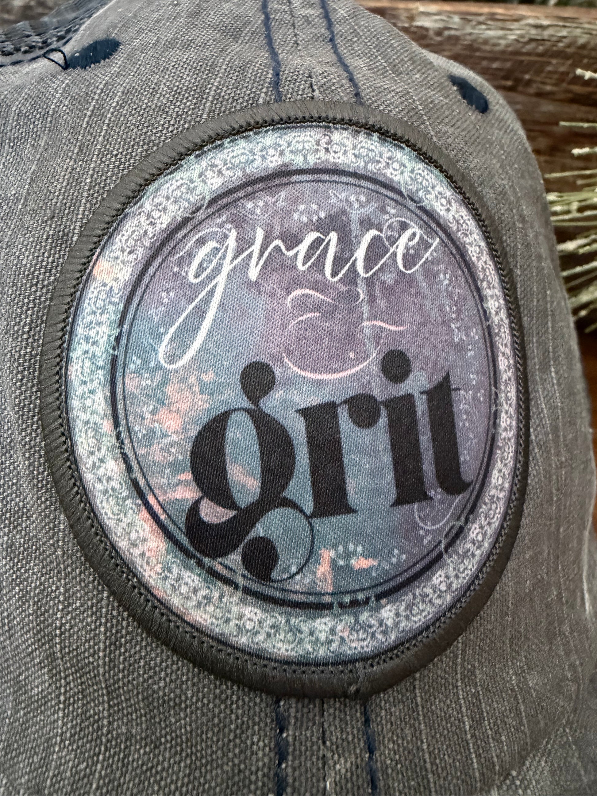 Patch with 'grace' and 'girl' text on a textured surface